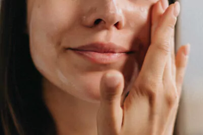 Woman applying serum