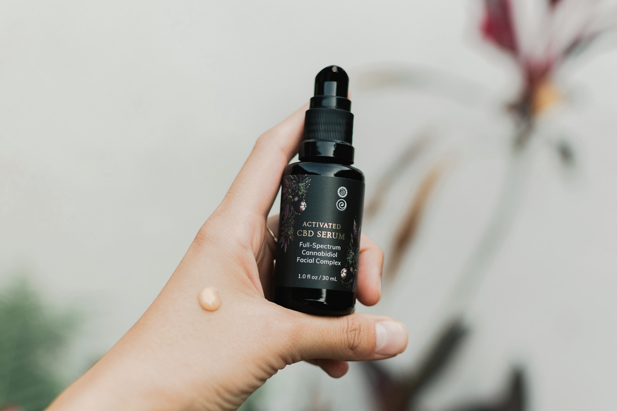 Hand holding Activated CBD Serum