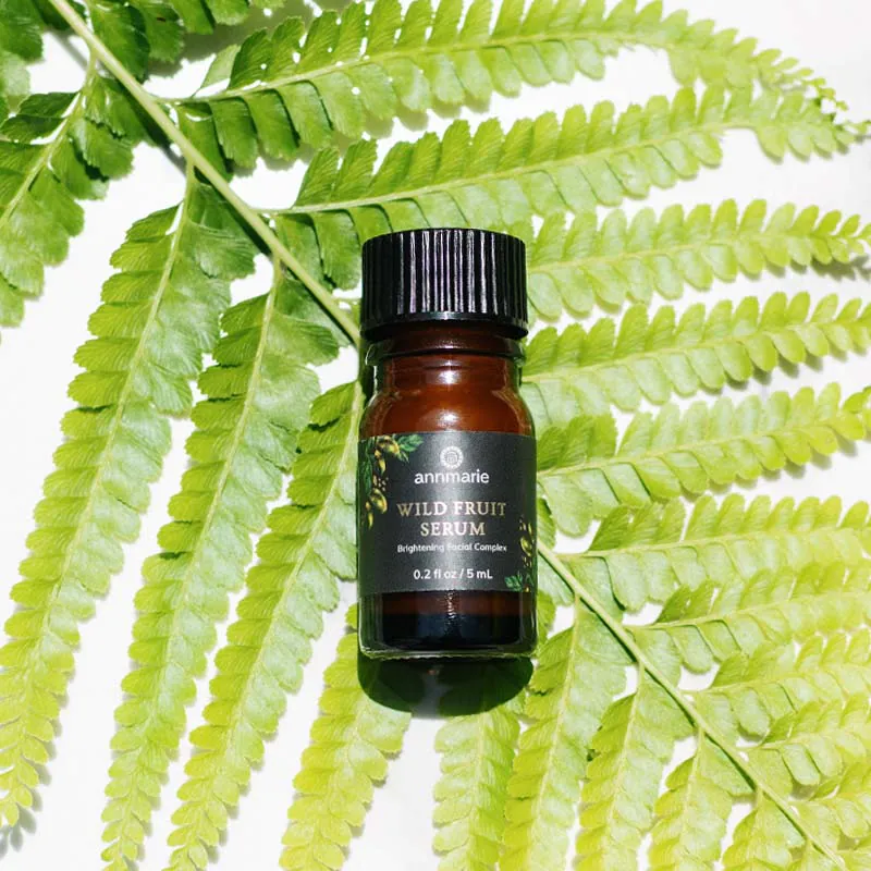 Wild Fruit Serum on a fern leaf background